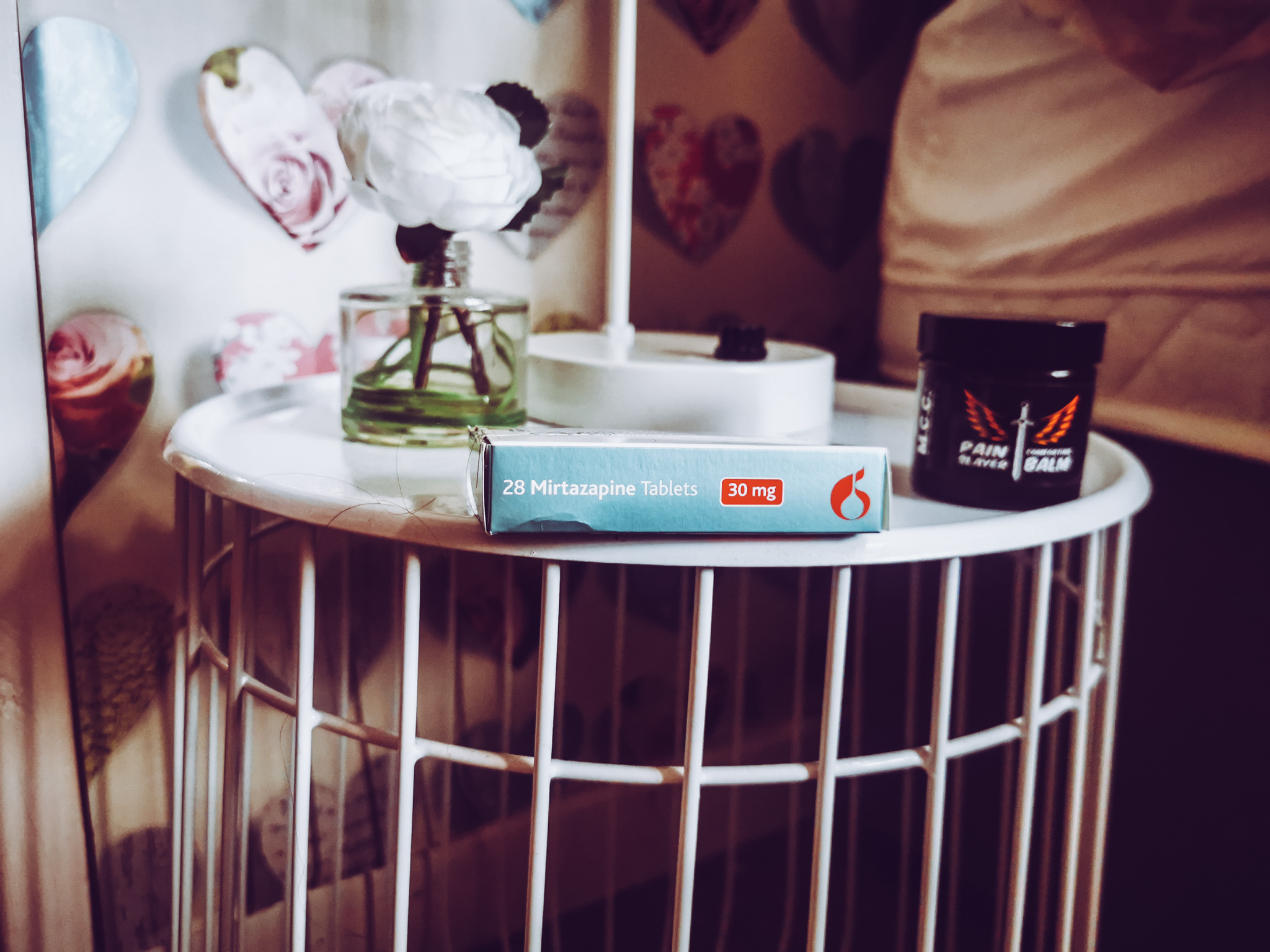 small box of mirtazapine on a bedside table