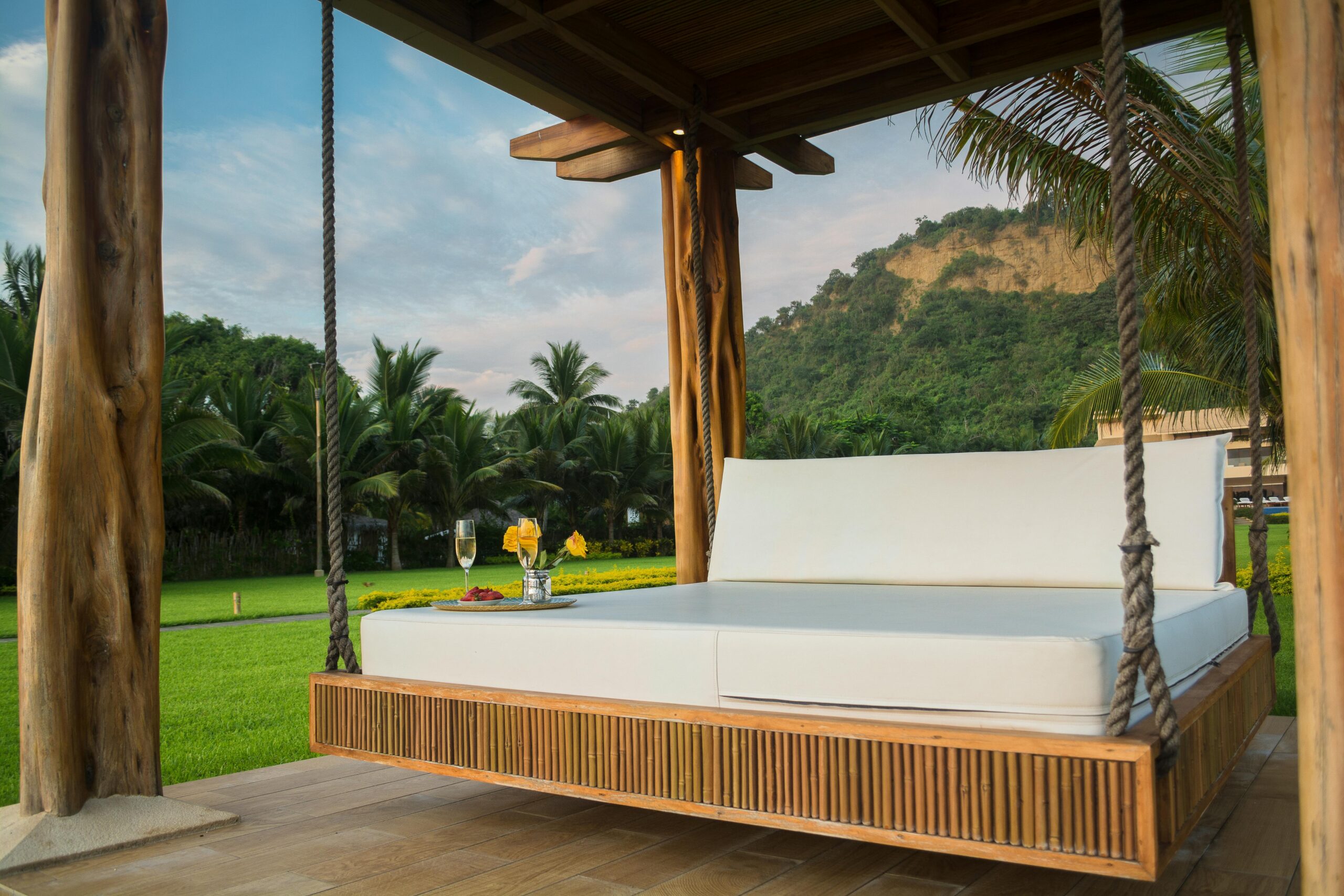 a swinging bed in an outdoor cabana